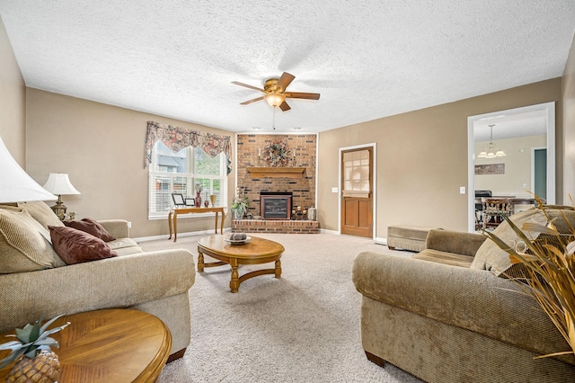 living room featuring a brick fireplace, baseboards, ceiling fan, a textured ceiling, and carpet flooring