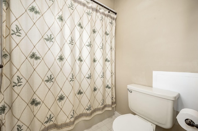 bathroom featuring toilet and tile patterned floors