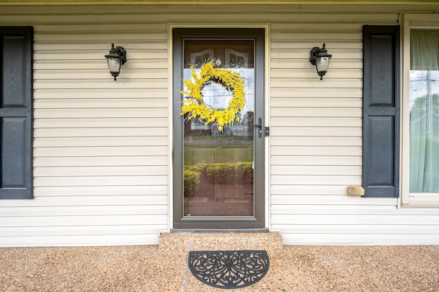 doorway to property with a porch