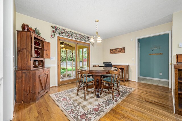 dining room with a chandelier and light wood-style floors