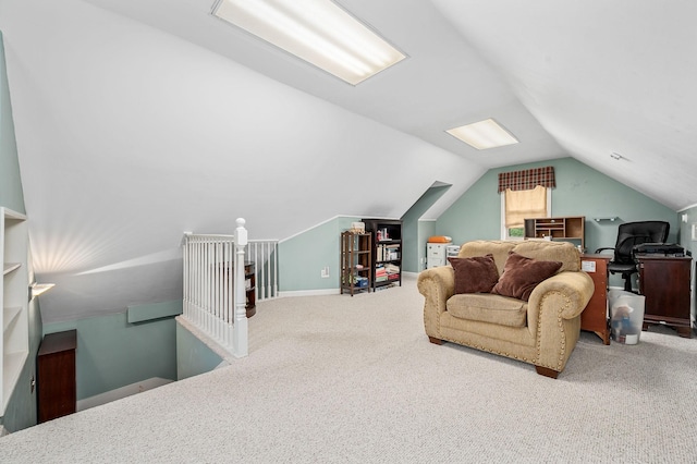 interior space featuring vaulted ceiling, baseboards, and carpet flooring