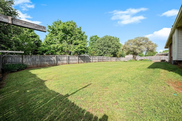 view of yard featuring a fenced backyard