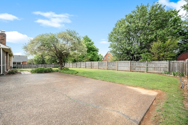 view of yard featuring a fenced backyard and a patio area