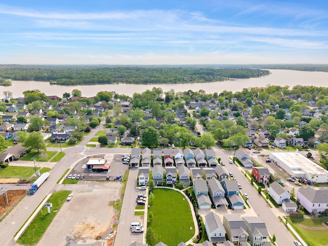 birds eye view of property with a water view and a residential view