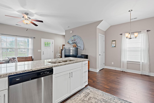 kitchen featuring light stone countertops, a sink, dishwasher, ceiling fan with notable chandelier, and dark wood-style floors
