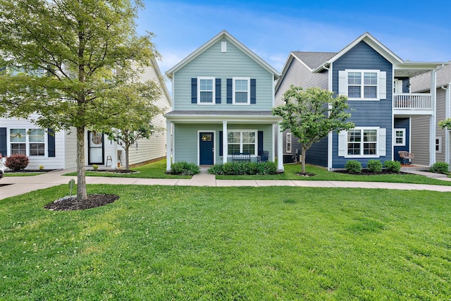 view of front of home with a porch and a front lawn