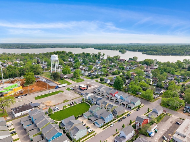 birds eye view of property with a residential view and a water view