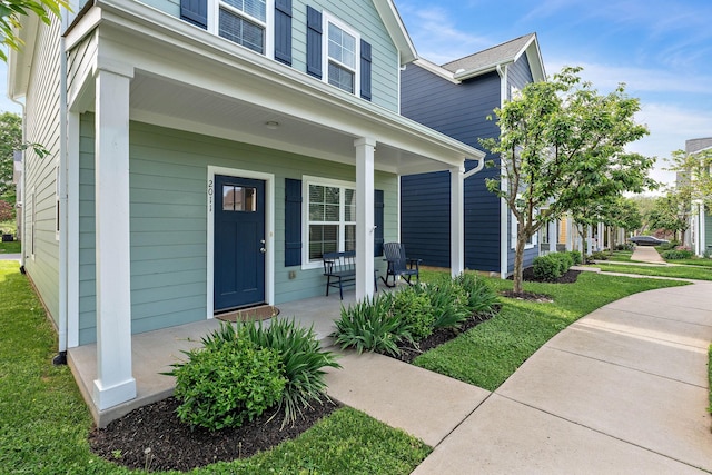 property entrance with covered porch