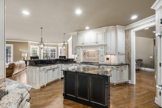 1136 Haverhill Dr, Brentwood, TN 37027 - kitchen featuring a peninsula, ornamental molding, recessed lighting, white cabinetry, and pendant lighting