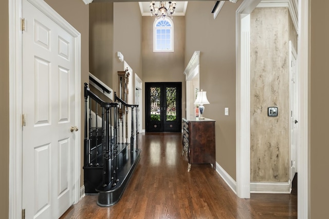 1136 Haverhill Dr, Brentwood, TN 37027 - entrance foyer featuring wood finished floors, a chandelier, stairs, crown molding, and a high ceiling