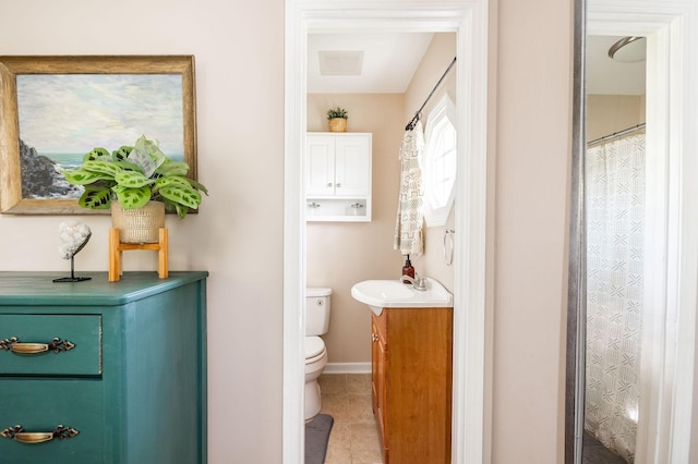 full bath with visible vents, tile patterned flooring, vanity, toilet, and baseboards