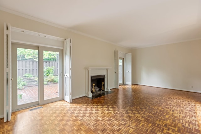 unfurnished living room featuring visible vents, ornamental molding, baseboards, and a fireplace