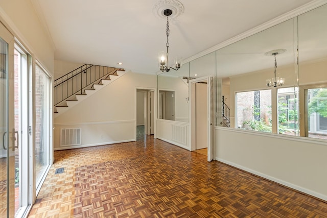 unfurnished room with stairs, baseboards, a notable chandelier, and visible vents