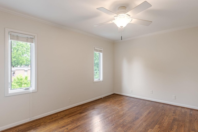 unfurnished room with crown molding, baseboards, ceiling fan, and wood finished floors