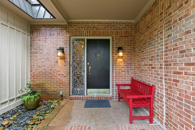 property entrance with brick siding