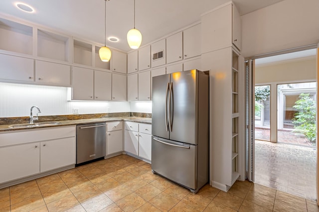 kitchen featuring open shelves, a sink, stainless steel appliances, white cabinetry, and visible vents
