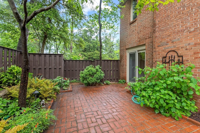 view of patio featuring fence