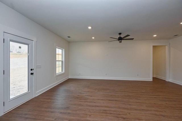 unfurnished living room with recessed lighting, dark wood-type flooring, baseboards, and ceiling fan