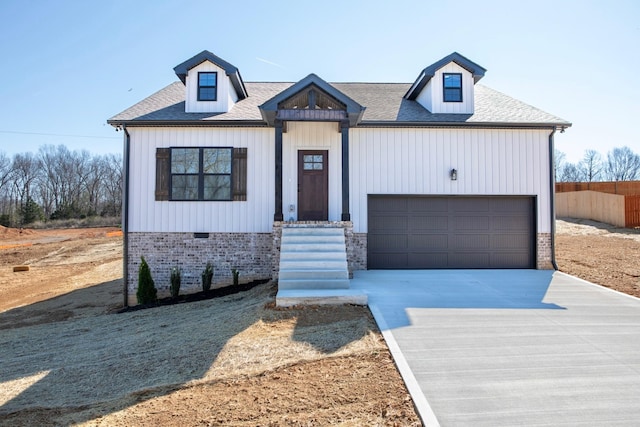 modern farmhouse with a garage, roof with shingles, fence, and concrete driveway