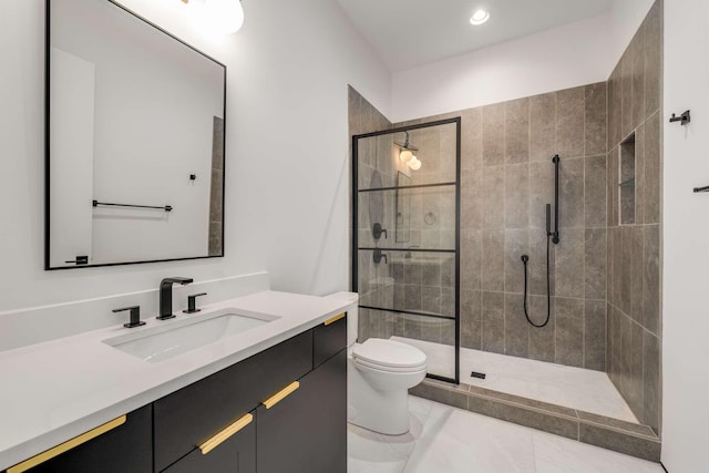 bathroom featuring vanity, recessed lighting, a stall shower, and toilet