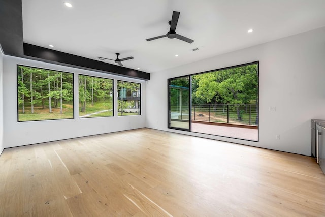 unfurnished living room featuring recessed lighting, ceiling fan, light wood finished floors, and visible vents