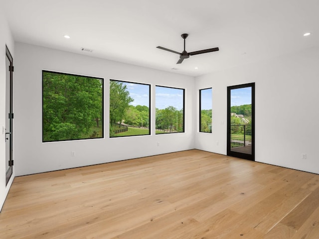 empty room with recessed lighting, ceiling fan, visible vents, and light wood-type flooring
