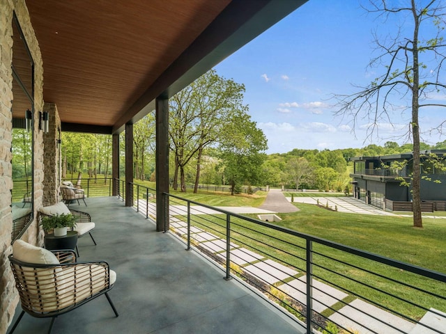 view of patio featuring a balcony