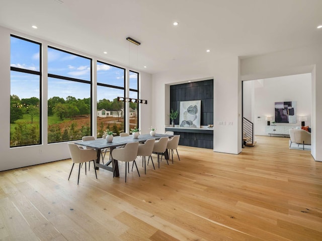 dining room featuring recessed lighting, a healthy amount of sunlight, and light wood-type flooring