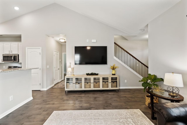 411 Barbaro Ct, Burns, TN 37029 - living room featuring stairs, dark wood-style flooring, high vaulted ceiling, and baseboards