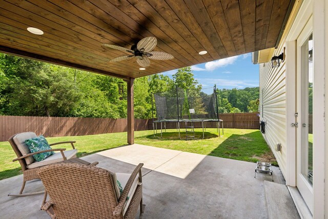 411 Barbaro Ct, Burns, TN 37029 - view of patio featuring a fenced backyard, a trampoline, and ceiling fan