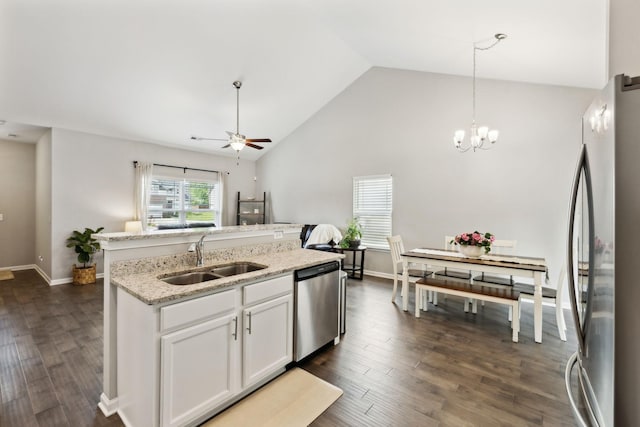 411 Barbaro Ct, Burns, TN 37029 - kitchen with an island with sink, white cabinets, a sink, ceiling fan with notable chandelier, and stainless steel appliances