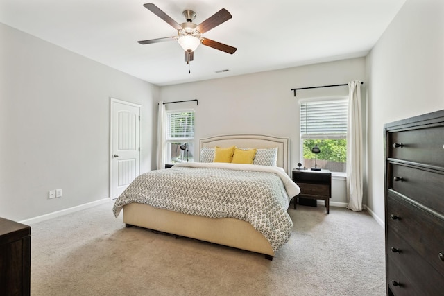 411 Barbaro Ct, Burns, TN 37029 - carpeted bedroom with baseboards, visible vents, multiple windows, and ceiling fan
