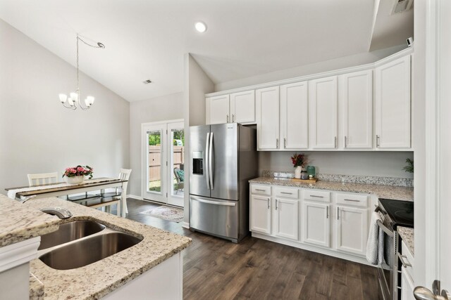 411 Barbaro Ct, Burns, TN 37029 - kitchen featuring lofted ceiling, white cabinets, a sink, dark wood finished floors, and stainless steel appliances