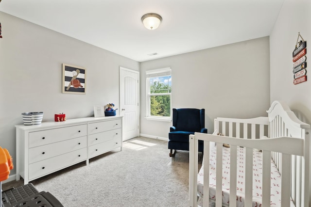 411 Barbaro Ct, Burns, TN 37029 - carpeted bedroom featuring a nursery area and baseboards