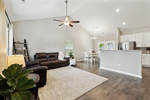 411 Barbaro Ct, Burns, TN 37029 - living room with dark wood finished floors, high vaulted ceiling, baseboards, ceiling fan with notable chandelier, and recessed lighting