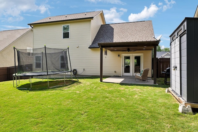 411 Barbaro Ct, Burns, TN 37029 - back of property with a patio, a ceiling fan, a fenced backyard, and a trampoline