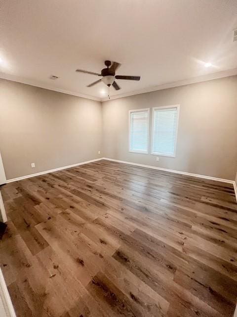unfurnished room featuring baseboards, ornamental molding, a ceiling fan, and wood finished floors