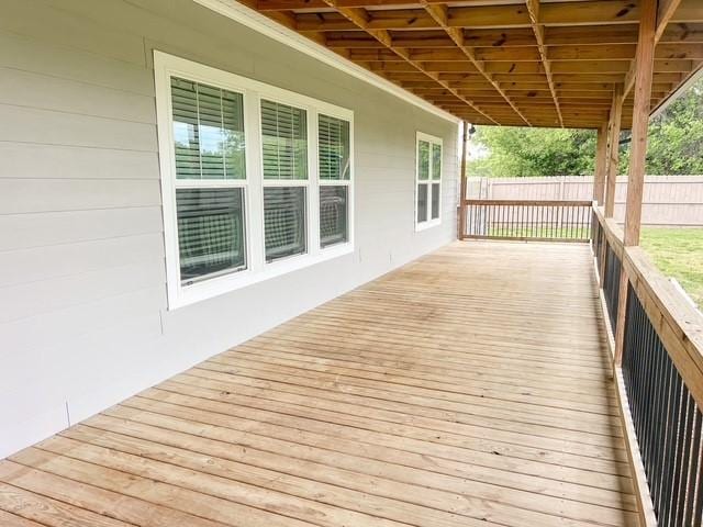 wooden deck featuring fence