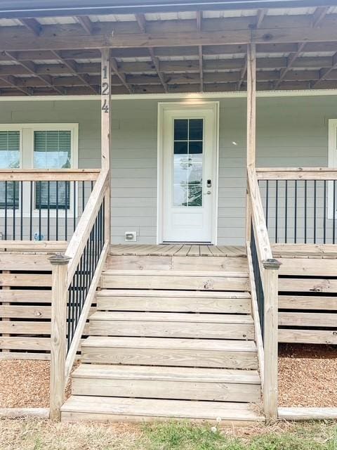 doorway to property with covered porch