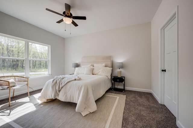 bedroom with baseboards, carpet, and a ceiling fan