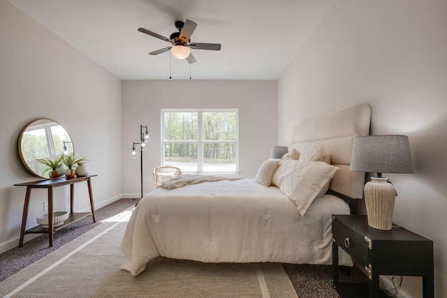 carpeted bedroom with baseboards