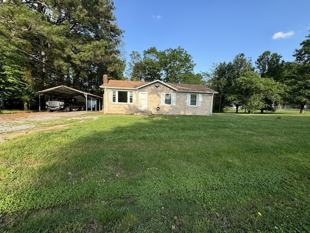 manufactured / mobile home featuring a detached carport, a front lawn, and a chimney
