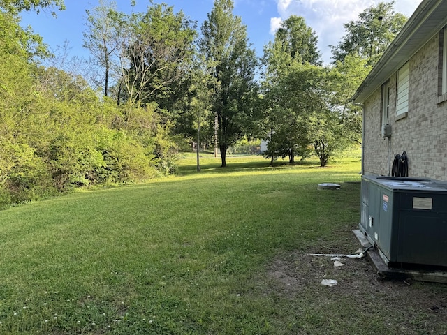 view of yard with central AC unit