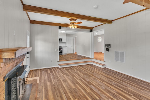 4043 Marydale Dr, Nashville, TN 37207 - unfurnished living room featuring visible vents, wood finished floors, beamed ceiling, baseboards, and a ceiling fan