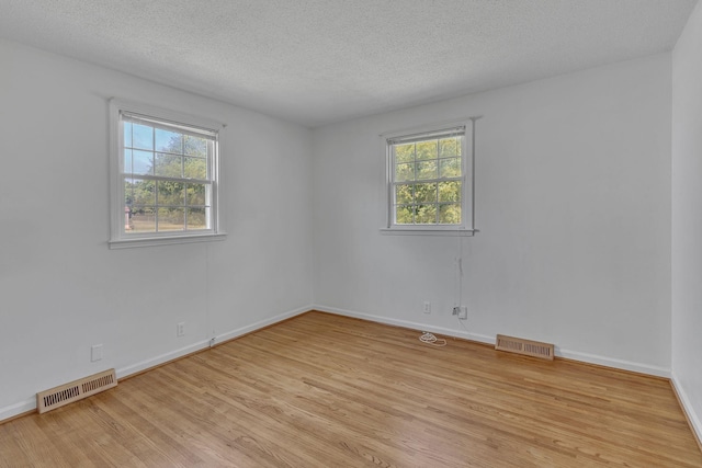 4043 Marydale Dr, Nashville, TN 37207 - unfurnished room featuring a textured ceiling, baseboards, light wood-style flooring, and visible vents