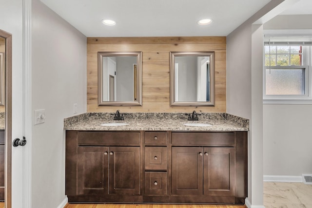 4043 Marydale Dr, Nashville, TN 37207 - bathroom with baseboards, a sink, double vanity, and visible vents