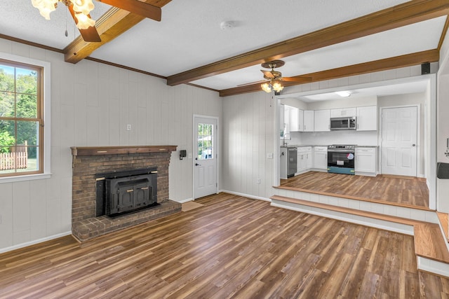 4043 Marydale Dr, Nashville, TN 37207 - unfurnished living room with beamed ceiling, ceiling fan, baseboards, and wood finished floors