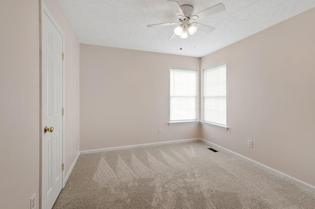 517 Wildwood Dr, Smyrna, TN 37167 - unfurnished room with ceiling fan, a textured ceiling, visible vents, baseboards, and carpet floors
