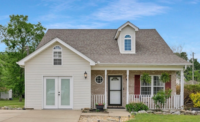 517 Wildwood Dr, Smyrna, TN 37167 - cape cod home with french doors, a shingled roof, and a porch