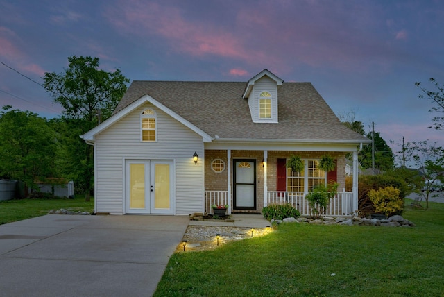 517 Wildwood Dr, Smyrna, TN 37167 - view of front of property featuring a porch, a shingled roof, brick siding, and a front yard